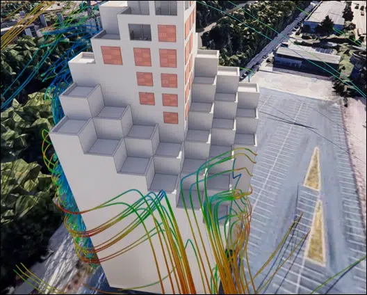 Simulación CFD 3D de las líneas de corriente coloreadas del viento alrededor de un edificio alto, vista en perspectiva