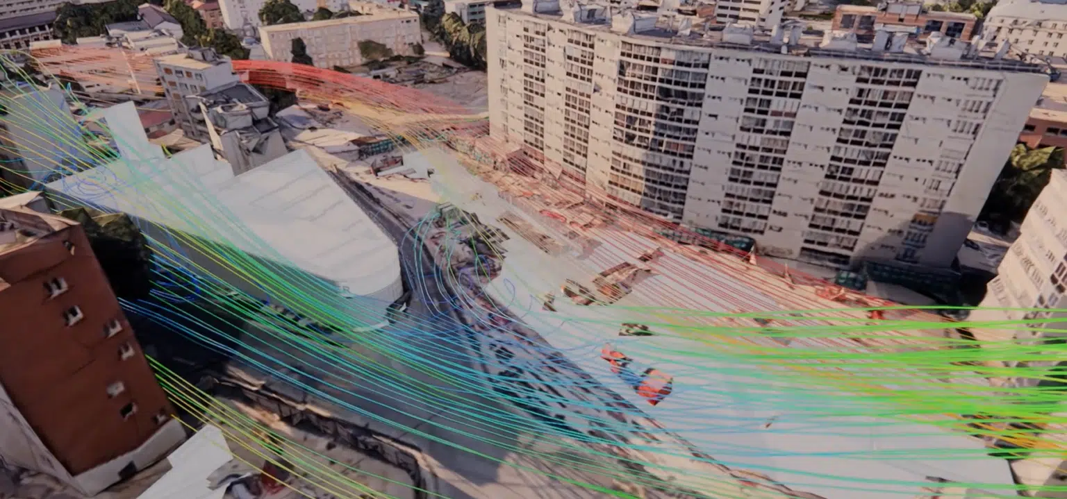 Modelo 3D externo de la estación — líneas de corriente de aire sobre vista aérea de la obra